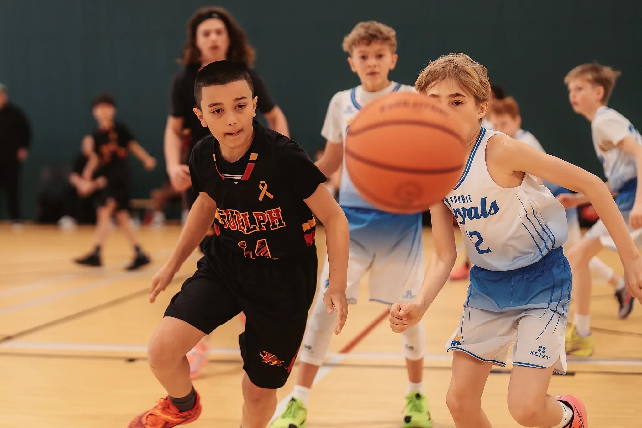 Junior Gryphons player driving to the basket during a league game