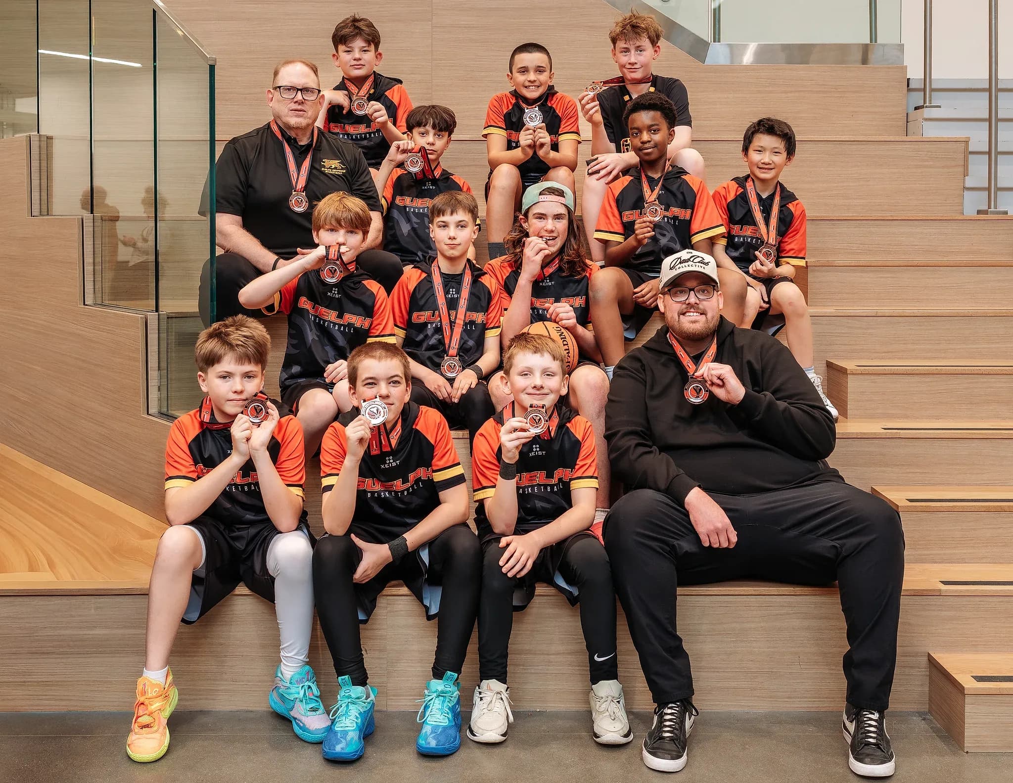 Junior Gryphons Rep team with their coaches and medals after a tournament