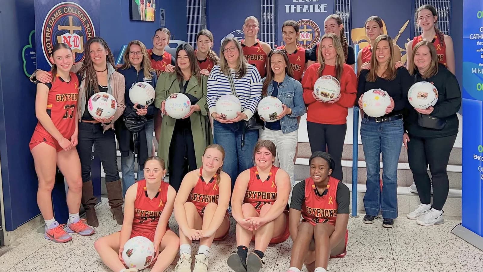 Junior Gryphons players and volunteers at a community event
